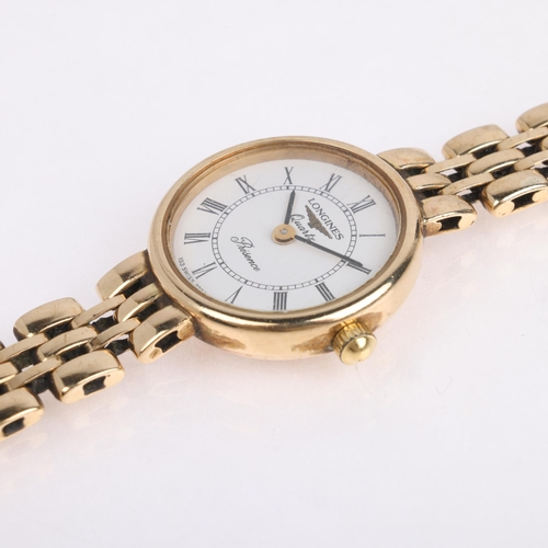 1069 - LONGINES - a lady's 9ct gold Presence quartz bracelet watch, white dial with Roman numeral hour mark... 