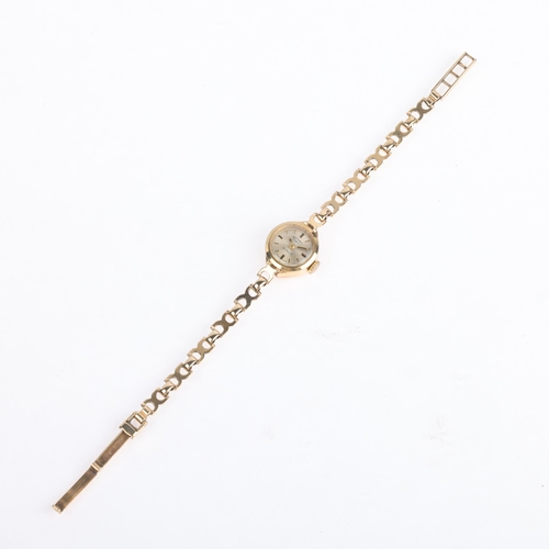 1070 - ROTARY - a lady's Vintage 9ct gold mechanical bracelet watch, silvered dial with gilt baton hour mar... 