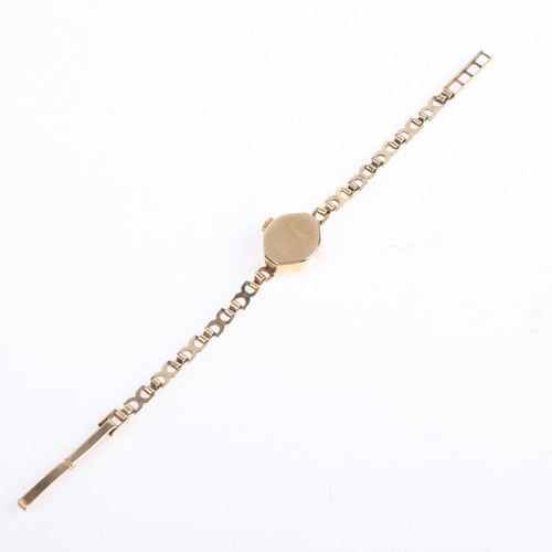 1070 - ROTARY - a lady's Vintage 9ct gold mechanical bracelet watch, silvered dial with gilt baton hour mar... 