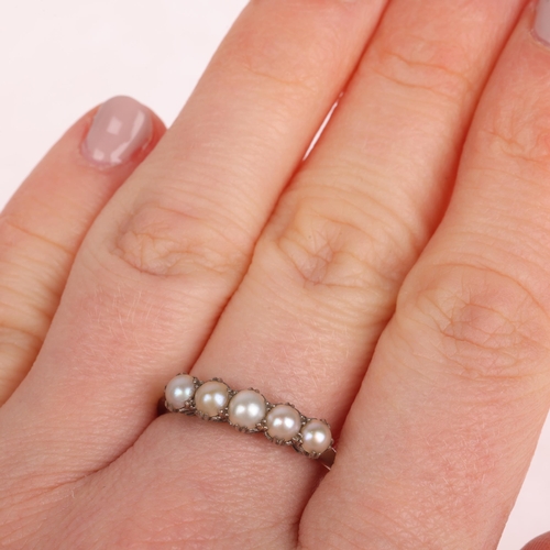 1115 - An Antique Edwardian 18ct white gold five stone split pearl half hoop ring, with fleur-de-lis bridge... 