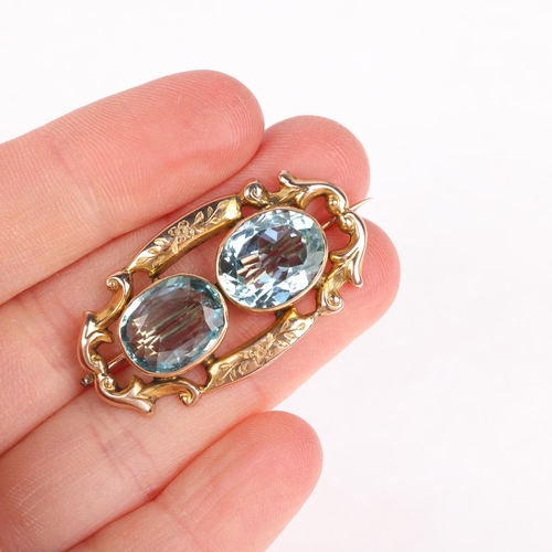 1120 - An Antique Victorian 9ct rose gold two stone aquamarine openwork brooch, rub-over set with oval mixe... 