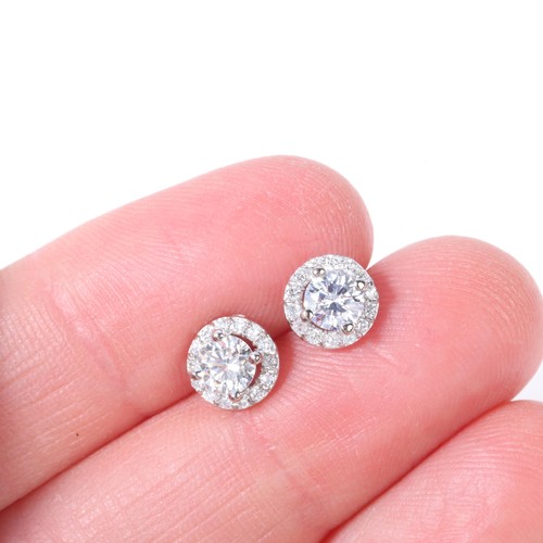 1145 - A pair of 18ct white gold diamond halo cluster stud earrings, set with modern round brilliant-cut di... 