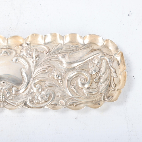 1798 - A late Victorian silver dressing table pin tray, William Comyns, London 1896, oval form with relief ... 