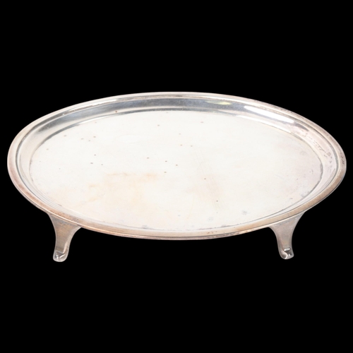 1800 - A George III silver teapot stand, William Brind, London 1799, plain oval form raised on 4 feet, with... 