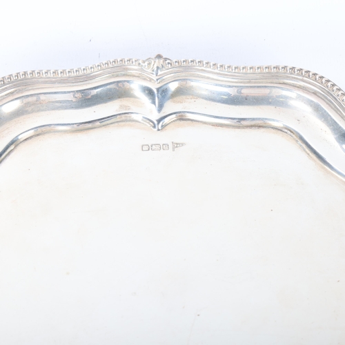 1802 - A George V silver salver, Walker & Hall, Sheffield 1910, hexagonal form, with piecrust edge and bead... 