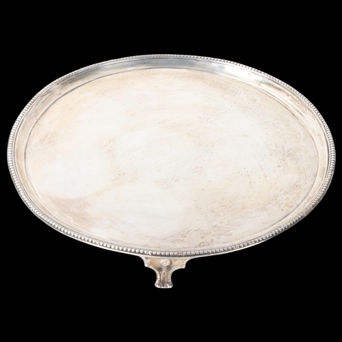 1803 - A George III silver salver, Thomas Graham & Jacob Willis, London 1810, circular form, with beaded ed... 