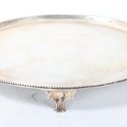 1803 - A George III silver salver, Thomas Graham & Jacob Willis, London 1810, circular form, with beaded ed... 