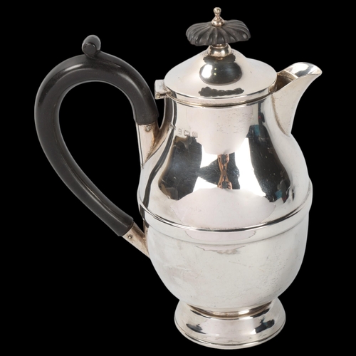 1805 - A George V silver hot water jug, A L Davenport Ltd, Birmingham 1932, waisted ovoid form, with ebonis... 