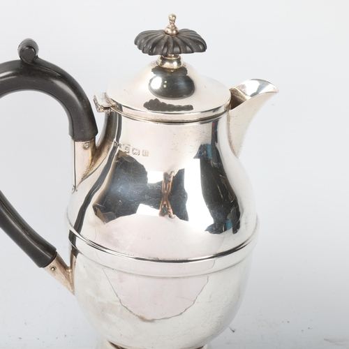 1805 - A George V silver hot water jug, A L Davenport Ltd, Birmingham 1932, waisted ovoid form, with ebonis... 