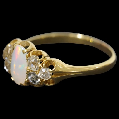 1118 - An Antique 18ct gold opal and diamond half hoop ring, set with oval cabochon opal flanked by a trio ... 