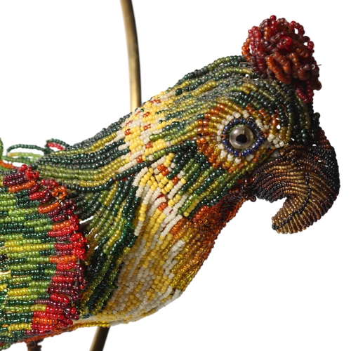 515 - A Venetian Murano glass beadwork Parrot lamp on a brass perch. Length 39cm from hanging loop to perc... 