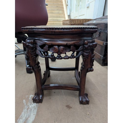 2213 - A Chinese hardwood Jardinière stand, with inset marble top and all-over carved and pierced decoratio... 