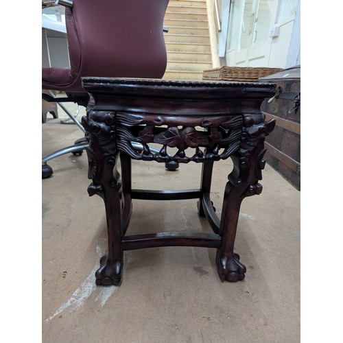 2213 - A Chinese hardwood Jardinière stand, with inset marble top and all-over carved and pierced decoratio... 