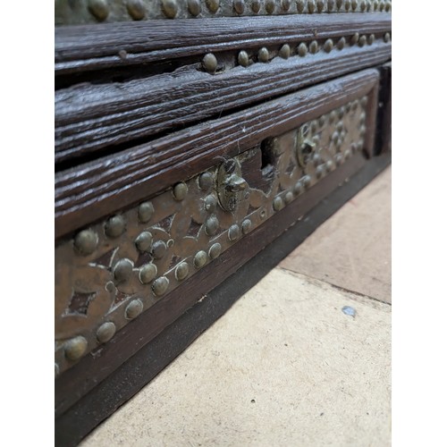 2218 - A 19th century Zanzibar trader's chest of hardwood construction, with copper and studded brass decor... 