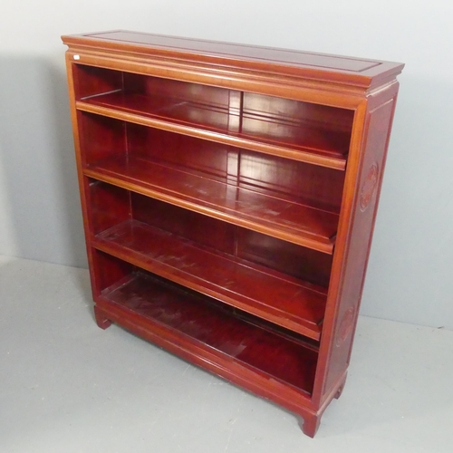 2112 - A Chinese hardwood open bookcase with three adjustable shelves. Width 107cm, height 122cm, depth 28c... 