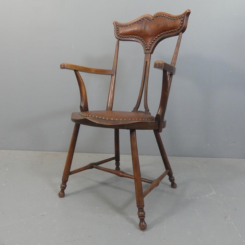 2140 - An Arts & Crafts oak and studded leather upholstered moustache back side chair, impressed H.S behind... 