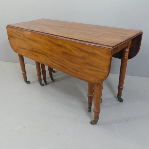 2147 - A George IV or Regency figured mahogany extending dining table, the drop flap end sections opening w... 