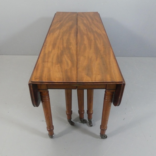 2147 - A George IV or Regency figured mahogany extending dining table, the drop flap end sections opening w... 