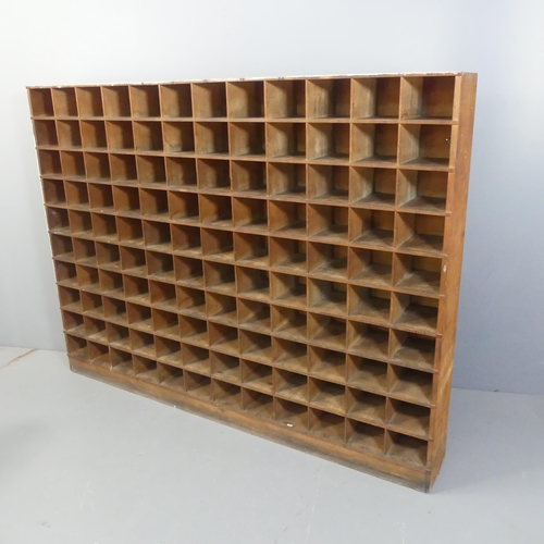 2151 - An antique French painted mahogany bank of 120 pigeon holes. Width 200cm, height 150cm, depth 24cm.