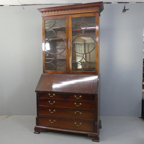 2155 - A reproduction mahogany three-section bureau bookcase. Width 123cm, height 233cm, depth 61cm.