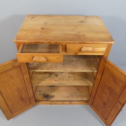 2199 - An antique pine larder cupboard, with two drawers over two panelled doors and shelf fitted interior.... 