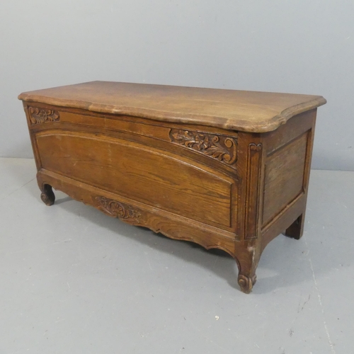 2205 - A French oak blanket box, with carved and panelled decoration. Width 98cm, height 46cm, depth 39cm.