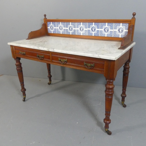 2206 - A Victorian mahogany and marble topped wash stand, with raised tiled back, two drawers, raised on tu... 