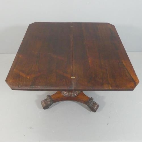 2220 - MEYER & BEKENN - A Regency rosewood fold-over tea table, with carved decoration and raised on turned... 