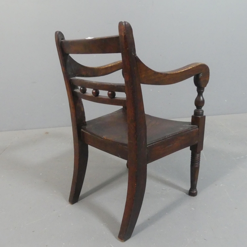 2221 - An antique mahogany and elm seated Georgian style child's chair. Overall height 54cm.