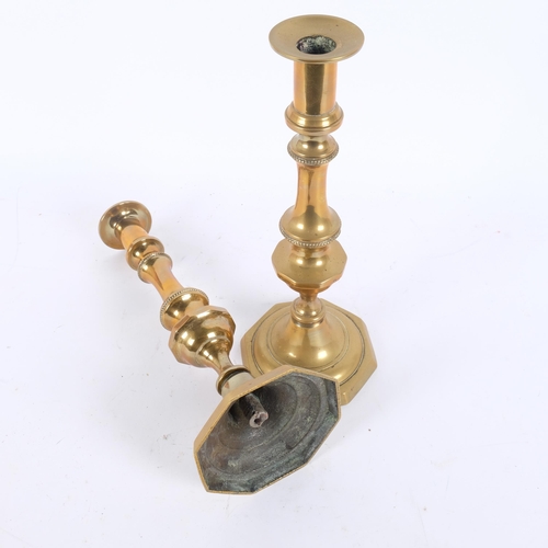 110 - A pair of 18th century brass column candlesticks, 30cm