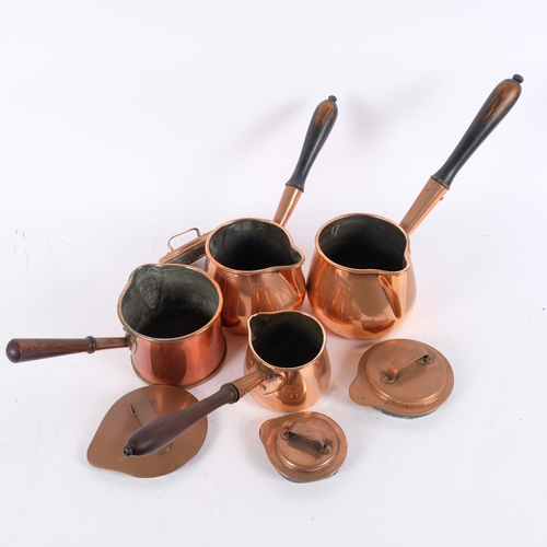 113 - A graduated set of 3 Victorian copper side-pouring pans, and another similar (4)