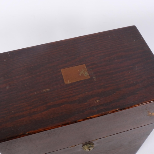 119 - An Antique stained oak decanter box, no key and currently locked, W25cm, H28cm, D14cm