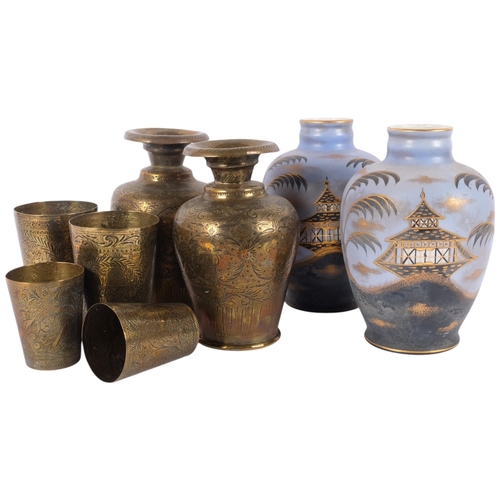 126 - A group of Middle Eastern engraved brass items, including pair of vases, beakers, etc