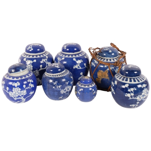 128 - 7 Chinese blue and white porcelain prunus pattern ginger jars and covers, largest 15cm