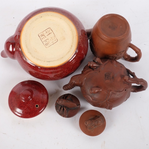 132 - 2 Chinese Yixing style clay teapots, and a Chinese redware teapot (3)