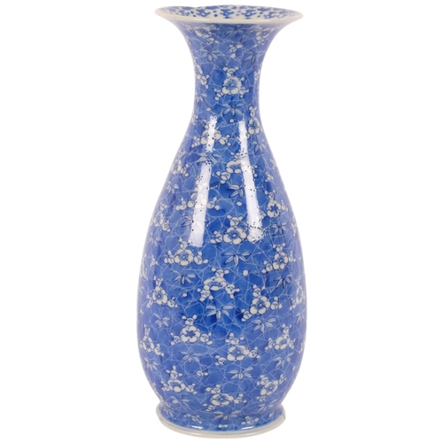 139 - A Japanese Seto Ware blue and white prunus baluster vase, Taisho Period, by Kato Yoshiku, 33cm (rim ... 
