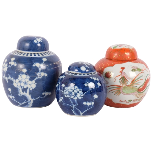 140 - 2 Chinese blue and white prunus pattern ginger jars and covers, and another, largest 15cm (3)