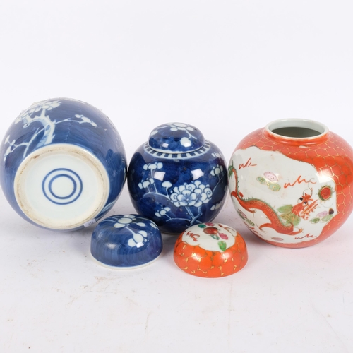 140 - 2 Chinese blue and white prunus pattern ginger jars and covers, and another, largest 15cm (3)