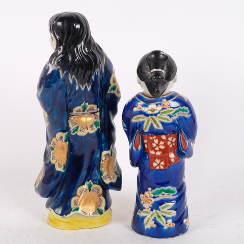 144 - 2 Japanese polychrome glaze pottery figures, including example holding a scroll, 30cm (2)