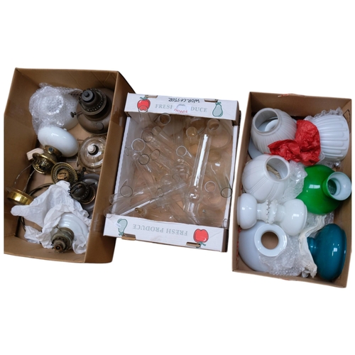 153 - A large quantity of oil lamp fittings, shades and funnels (3 boxes)