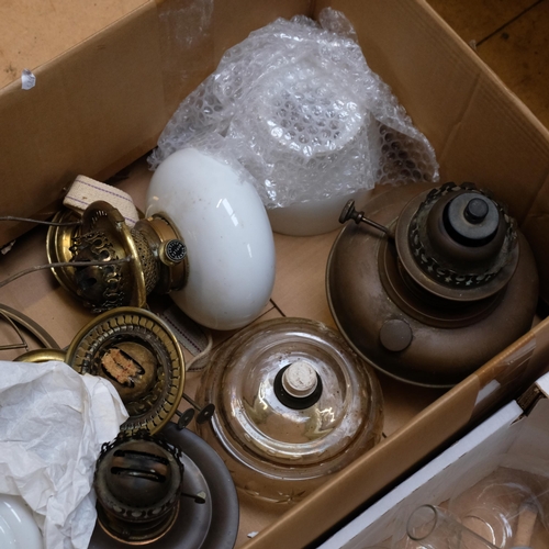 153 - A large quantity of oil lamp fittings, shades and funnels (3 boxes)