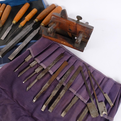 166 - An Antique woodworking plough/rebate plane, a roll of various cutters, and a collection of various w... 