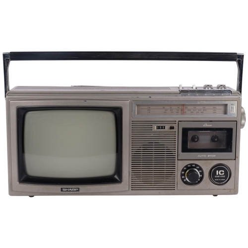 174 - A Vintage Sharp portable TV, radio and tape cassette player, with mains cable