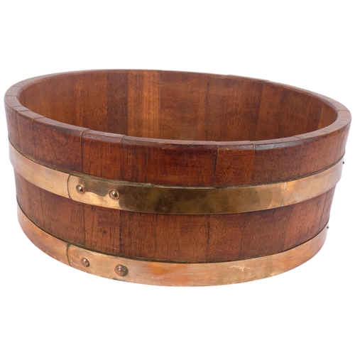 180 - A coopered oak half barrel/jardiniere stand, diameter 45cm, height 16cm