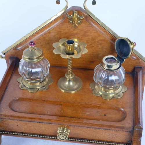 2 - A Victorian Gothic brass-mounted oak desk inkstand, with original removeable glass fitted inkwells, ... 