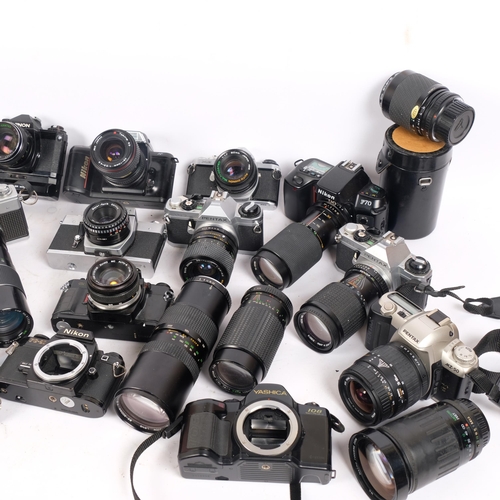 201 - A large quantity of various cameras and lenses, including an Olympus OM40, a Praktica LT, a Nikon FG... 