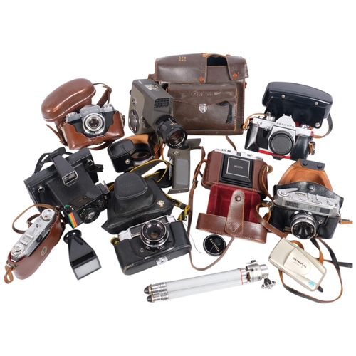 202 - A collection of various Vintage cameras, including a Zeiss Ikon Contaflex, cased, a Canon zoom 8 cin... 