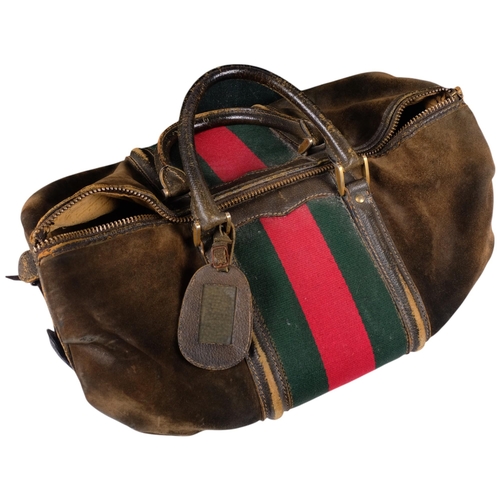 205 - GUCCI - 2 Vintage Gucci travel cases, including an olive leather holdall, with a small leather label... 