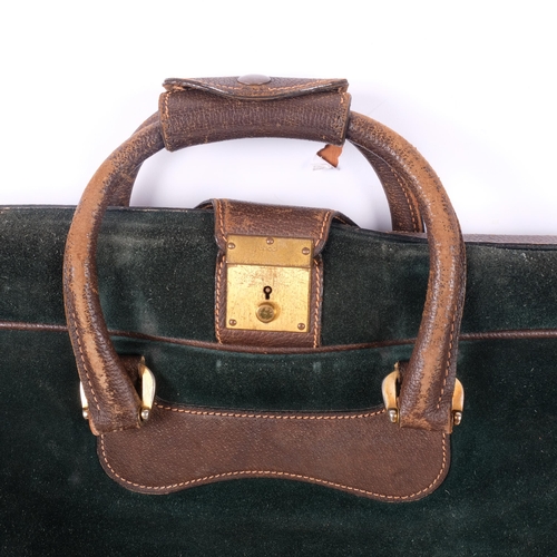 205 - GUCCI - 2 Vintage Gucci travel cases, including an olive leather holdall, with a small leather label... 