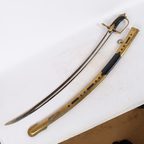 29 - Good quality reproduction sabre, with leather and brass hilt, and brass-mounted leather-covered scab... 